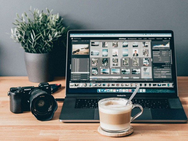 Camera, coffee and a laptop